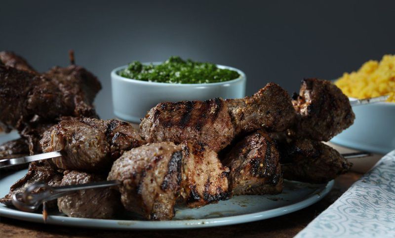 Grilled Rosemary-Thyme Lamb Skewers with Pine Nut-Olive Cauli-Rice